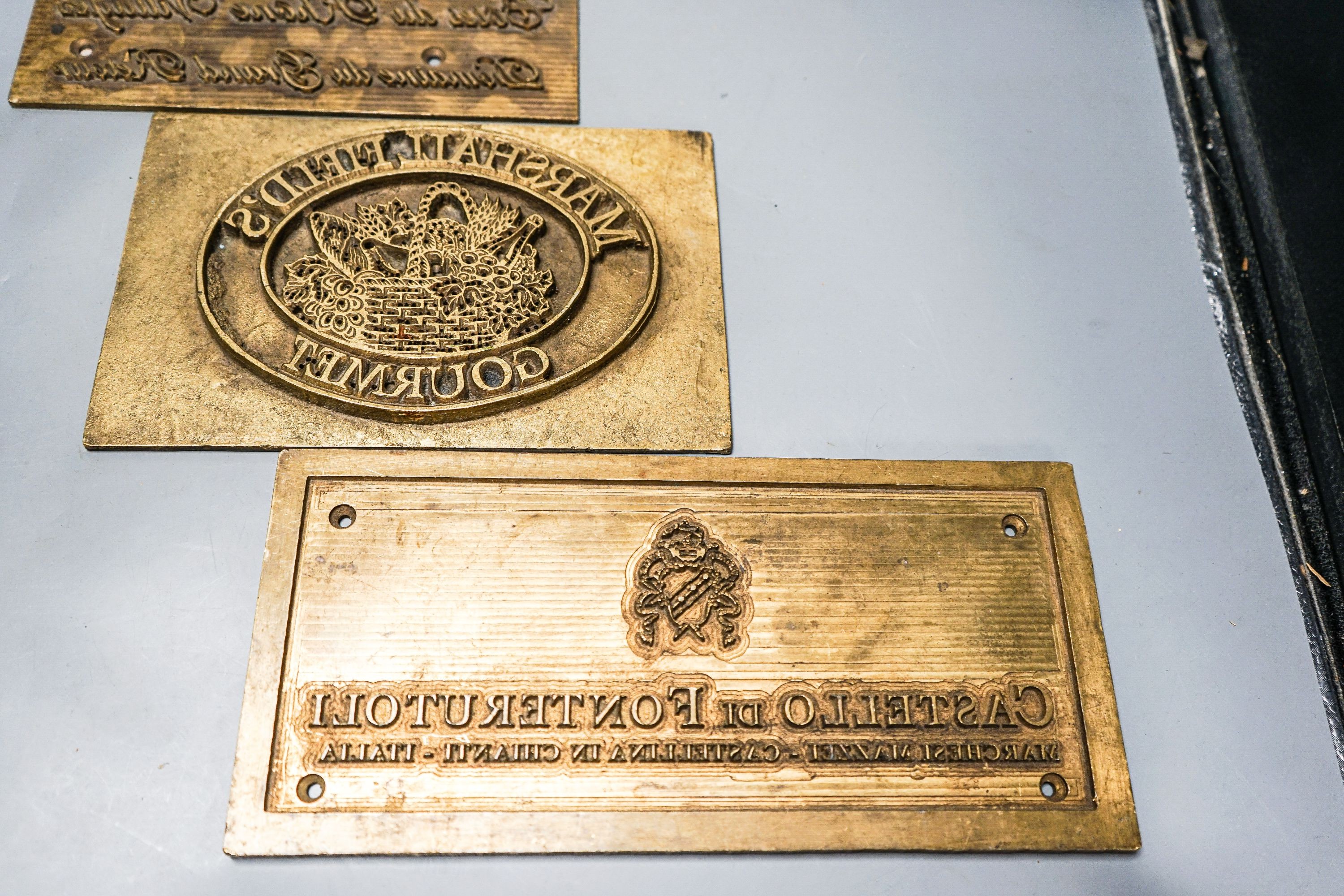 Three wine related brass printing plates